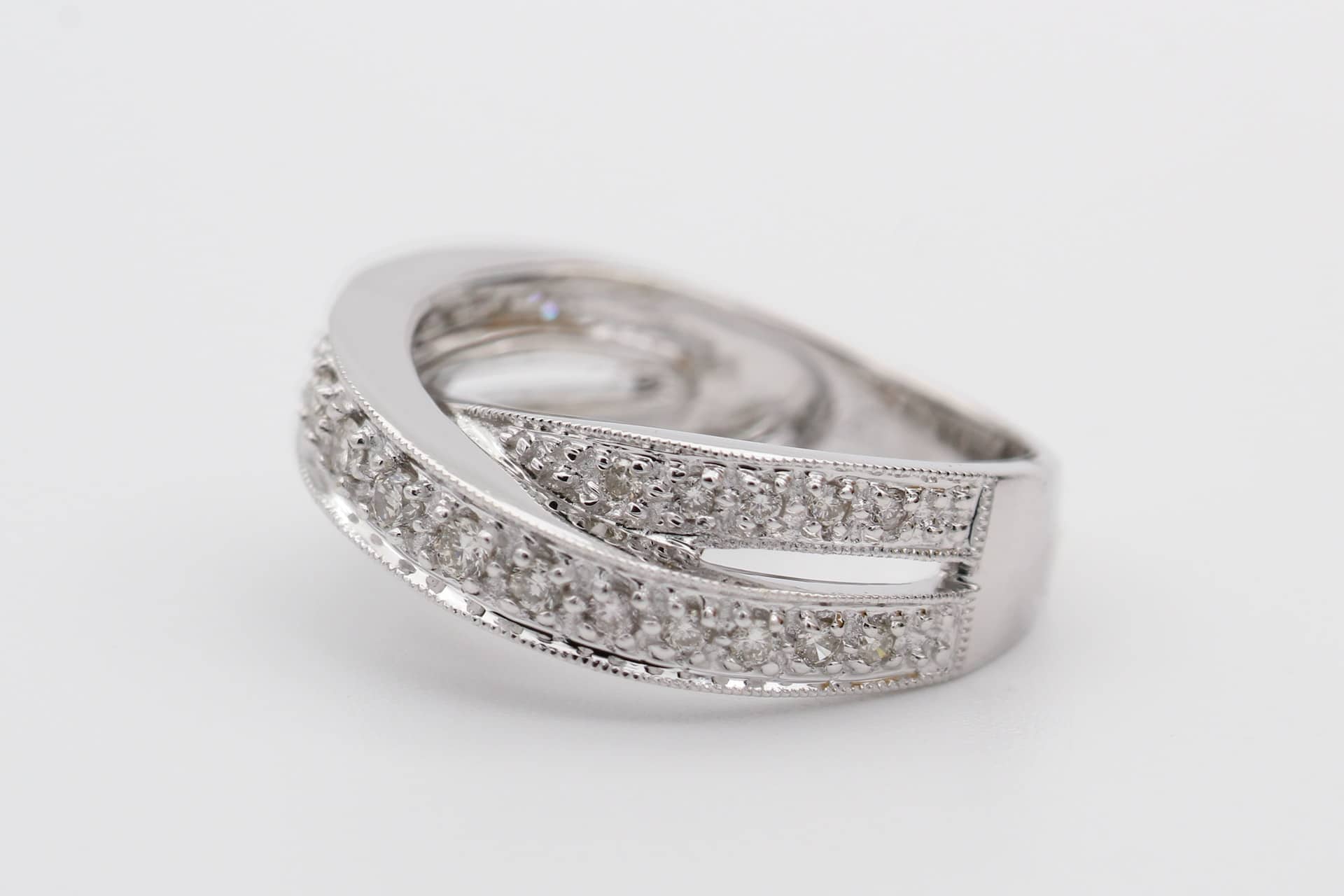 A silver double-loop diamond ring